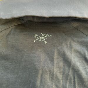 Arcteryx navy polo shirt